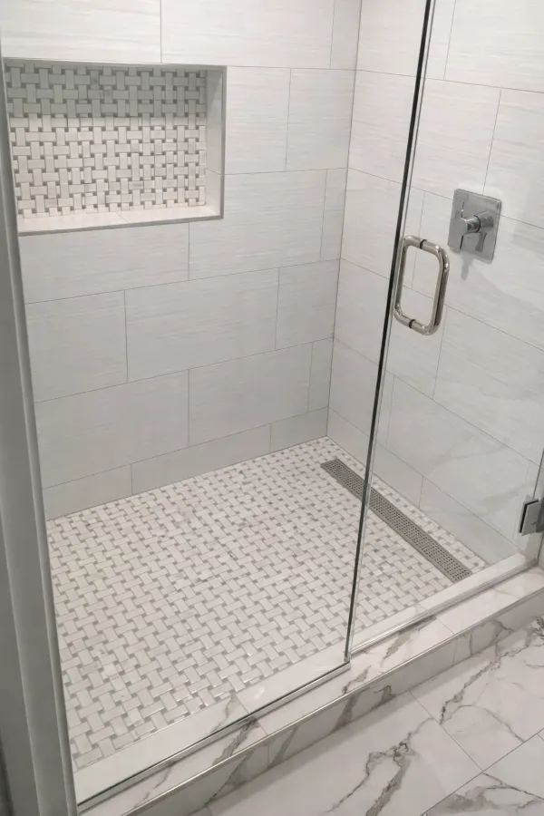 Basement remodel with bathroom walk-in shower, tile surround, and glass enclosure in northeast Portland home