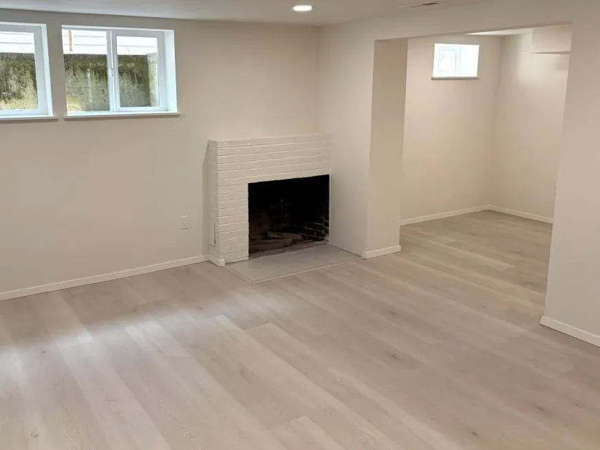 Basement remodel with living area, fireplace, and separate flex space in Mt. Tabor southeast Portland home