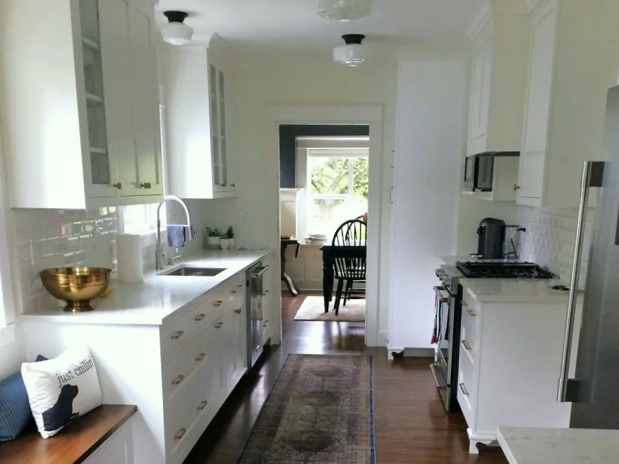 Classic white cabinet kitchen remodel with galley layout in Brooklyn southeast Portland home