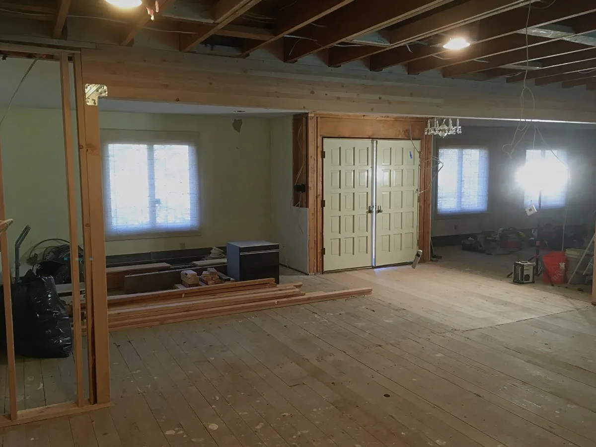Structural beam and widened main-floor opening during an NE Portland remodel